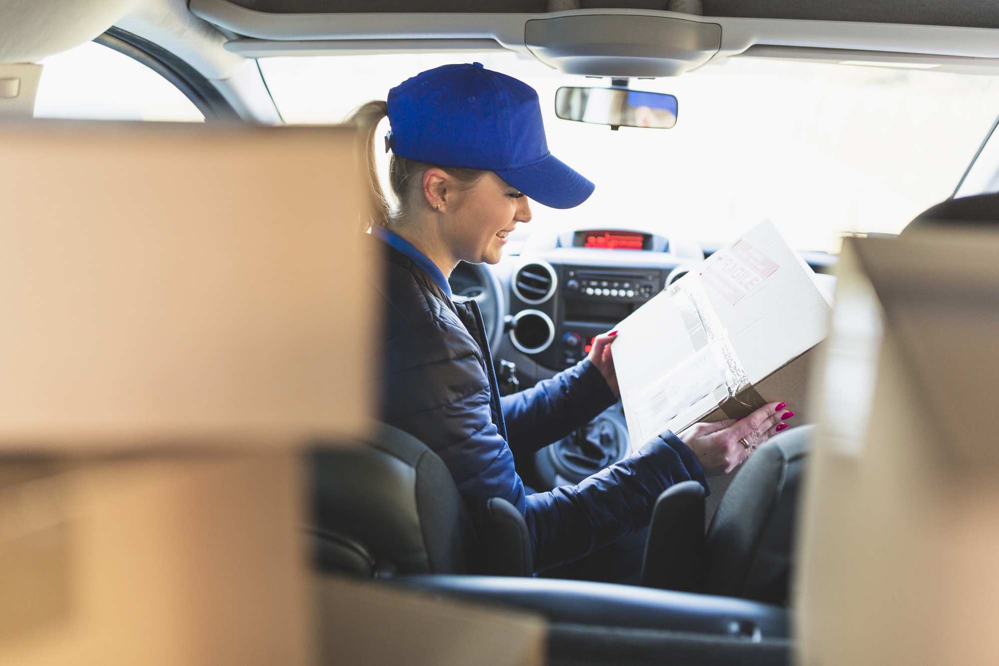 woman-with-packed-box-car